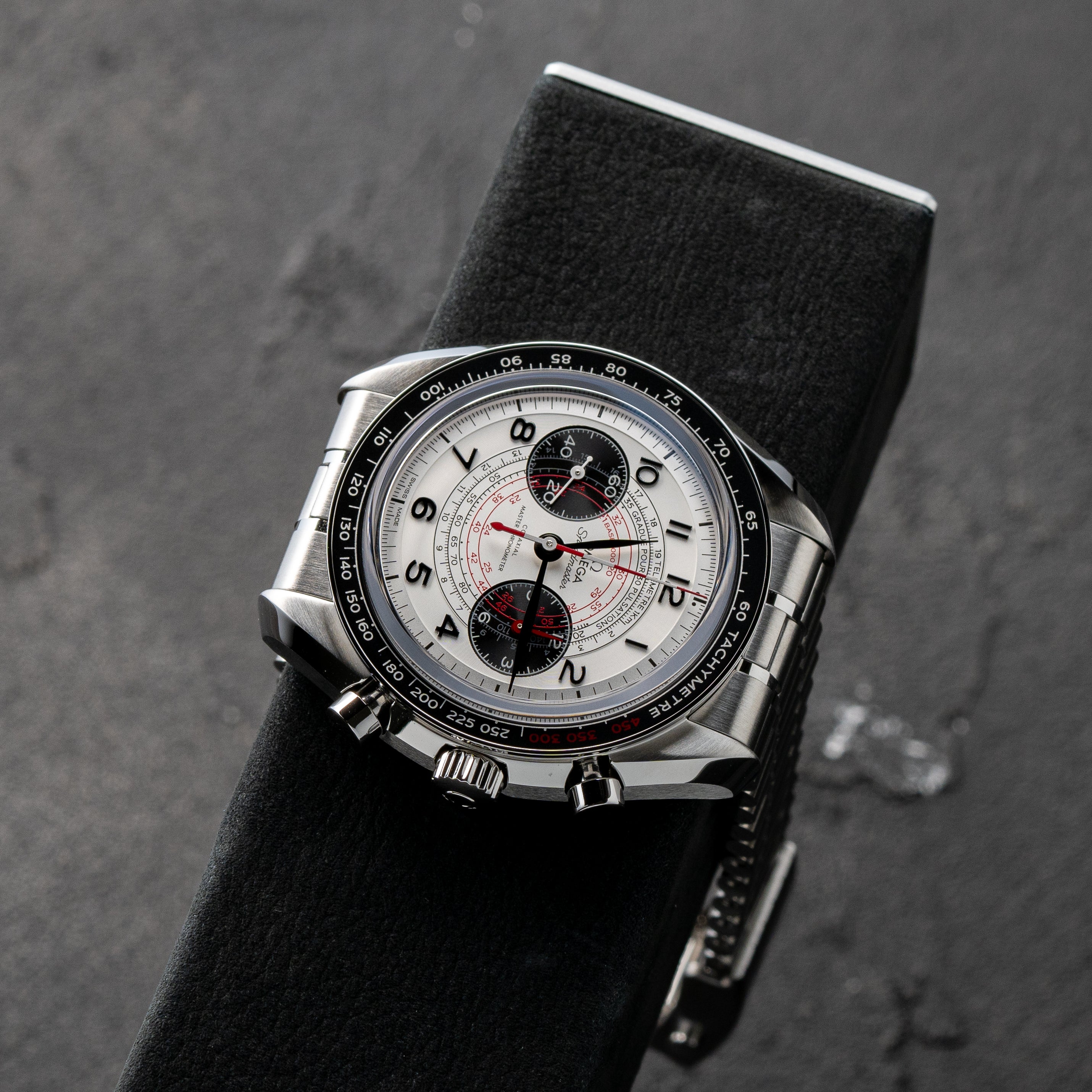 Authentic Omega Speedmaster Chronoscope Silver Dial Charles Simon watch stand
